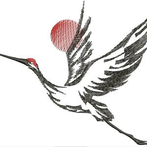 May include: An embroidered design of a crane in flight, featuring black and white plumage with a red head and a red sun in the background. The crane is depicted with its wings spread, suggesting movement against a white backdrop.