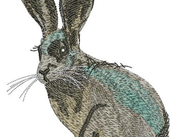 Peut inclure: Broderie d'un lièvre dans des tons de gris, beige et sarcelle. Le lièvre est représenté assis, avec de longues oreilles et des moustaches détaillées. Le motif a un aspect texturé et cousu.