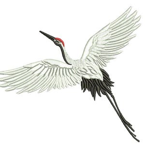 May include: An embroidered design of a crane in flight, featuring white wings, a red crown, and black accents. The crane's wings are outstretched, and its long legs trail behind it. The design is on a white background.