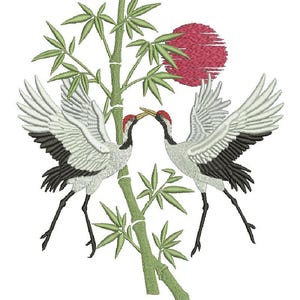 May include: An embroidered design featuring two cranes with outstretched wings, facing each other. The cranes have white and black feathers, red crowns, and long black legs. A red sun and green bamboo stalks and leaves complete the design.
