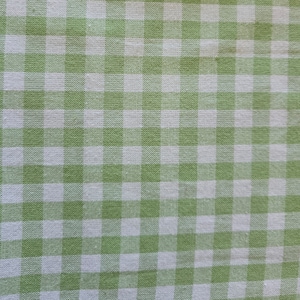 May include: Green and white checkered fabric with a woven texture.