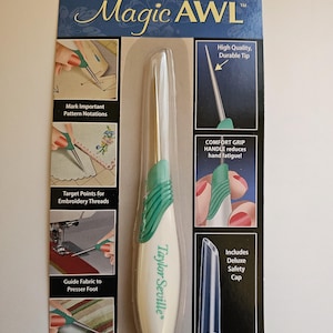 May include: A Taylor Seville Magic AWL tool on a product package. The tool has a white and green handle and a silver tip. The package includes text that says "High Quality, Durable Tip" and "Comfort Grip Handle reduces hand fatigue!"