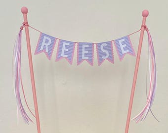 Personalized cake topper bunting-style in pastel purple and pink shades