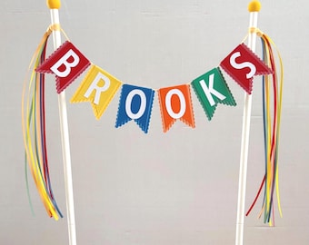 Personalized cake topper bunting-style in colorful primary colors + orange