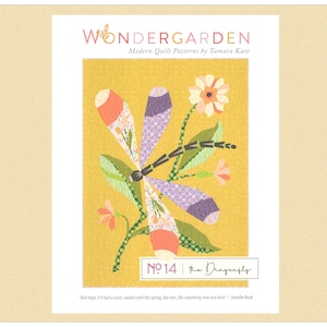 May include: A quilt pattern by Tamara Kate, titled "Wondergarden", showcasing a dragonfly design. The dragonfly has orange, purple, and white wings, with green leaves and flowers on a yellow background. The pattern is labelled "No. 14 the Dragonfly."
