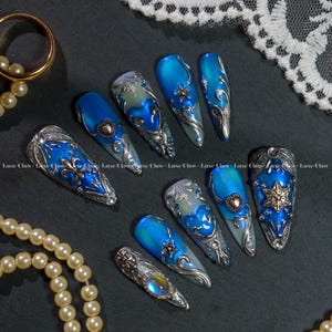Royal Fantasy Press On Nails, Blue Silver Nail Armor, Celestial Star Tips, Moon Heart Gothic Nails, Winter Chrome Nail Art