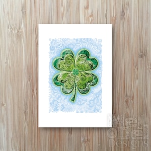 May include: A green four-leaf clover with intricate patterns on each leaf. The clover is surrounded by a white background with a light blue border.