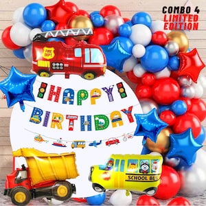 May include: A birthday party decoration set featuring a red fire truck, a yellow school bus, a yellow dump truck, and a banner that says "Happy Birthday". The set also includes blue, red, and white balloons in various shapes, including stars.
