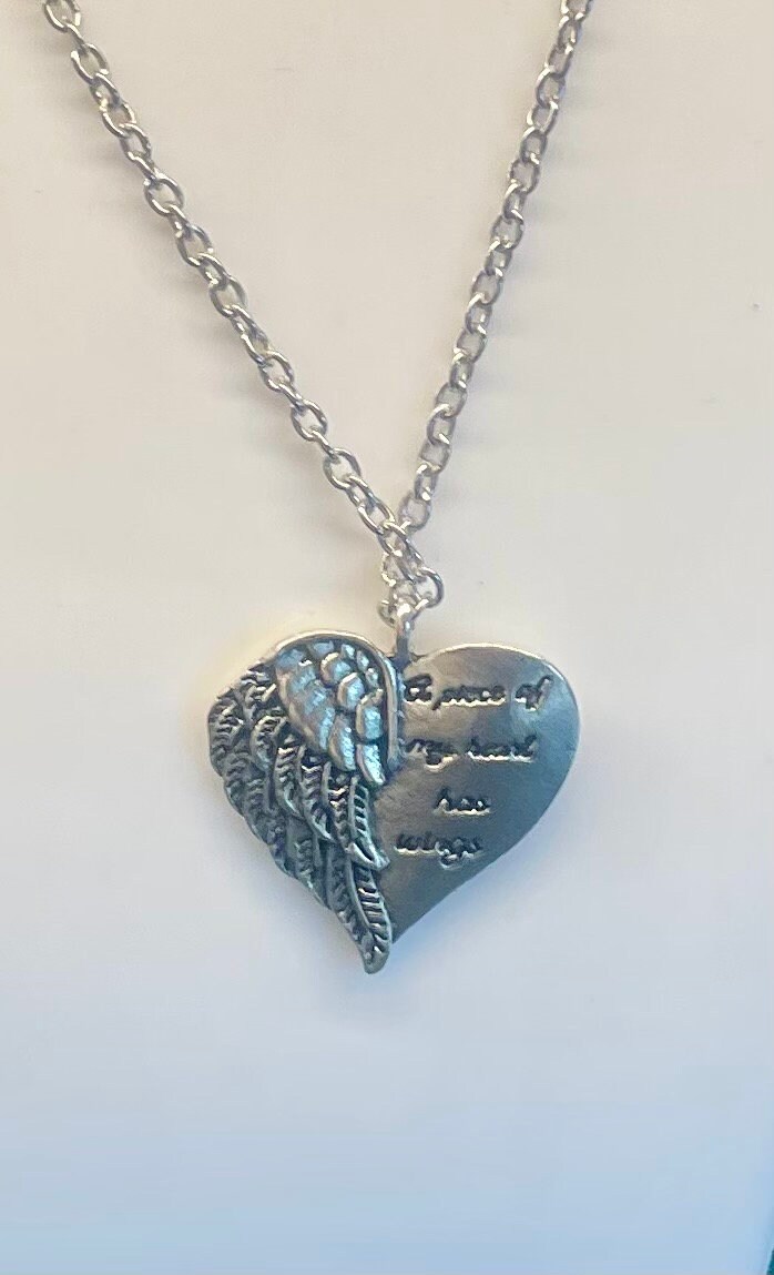 A piece of my sale heart has wings necklace