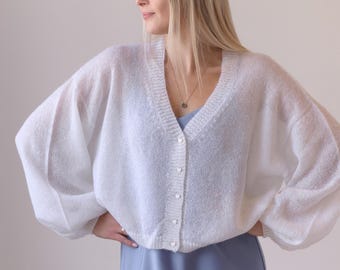 White mohair and silk bridal cardigan with heart shape buttons for wedding day.