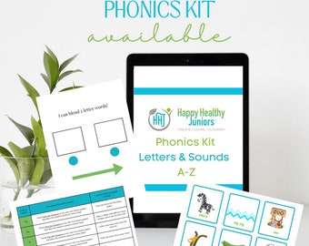 May include: A colourful phonics kit for children featuring a tablet screen with the words "Happy Healthy Juniors Phonics Kit Letters & Sounds A-Z" and several flashcards with pictures of animals and objects, including a zebra, a zig zag, a zucchini, and the number zero.