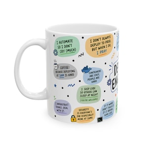 May include: A white ceramic mug featuring a variety of colourful speech bubbles with text related to software engineering, including phrases like I automate so I don't cry, containers are easy, and security is everyone's job, plus small icons.