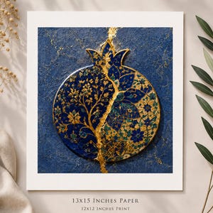 May include: A square art print on premium matte paper featuring a stylized pomegranate design in deep blue and gold. The pomegranate is split by a jagged gold line, with intricate floral patterns on both sides. Text reads 13x15 INCHES PAPER, 12x12 INCHES PRINT.