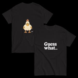 May include: Black t-shirts with a chicken graphic and the text "Guess what..". The chicken is yellow, orange, and brown. The text is white.