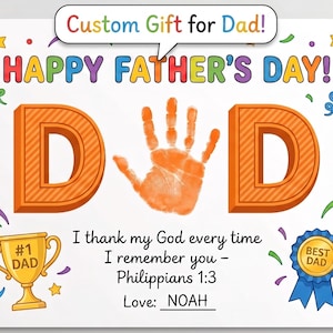 May include: A white Father's Day card featuring the text Custom Gift for Dad! and HAPPY FATHER'S DAY! in colorful letters. The word DAD is written with an orange handprint as the letter A. Includes a gold trophy, blue ribbon, and Philippians 1:3.