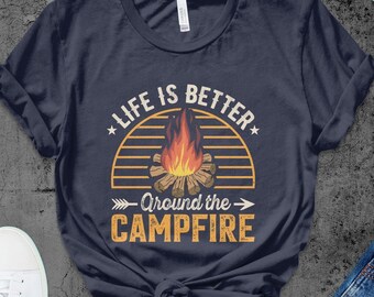 May include: Navy blue t-shirt with a campfire graphic and the text "Life is better around the campfire".