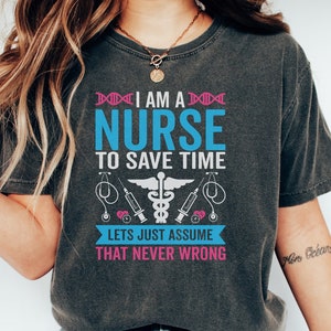 May include: A gray t-shirt with a blue and pink graphic that says "I am a nurse to save time. Lets just assume that never wrong."