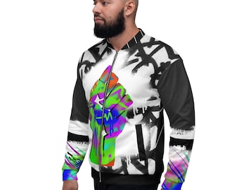 May include: A black and white bomber jacket with a colorful fist graphic on the front. The jacket has a zipper closure and a stand-up collar.
