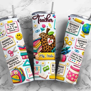 May include: Three white insulated tumblers with colorful teacher-themed designs. Each tumbler features school supplies, inspirational quotes, and the word "Teacher". One tumbler has the name "Mrs. Amelia".
