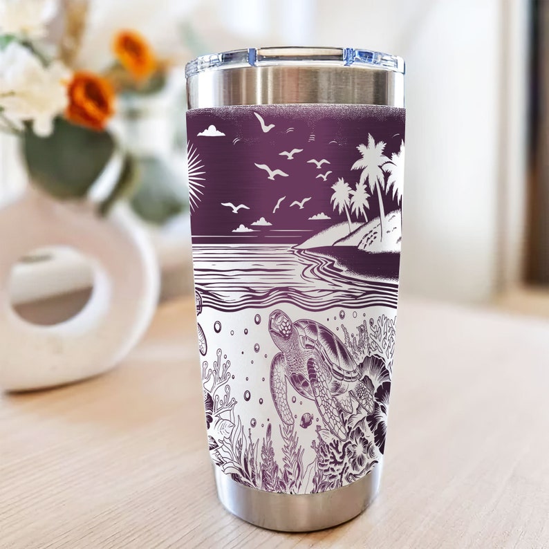 May include: A stainless steel tumbler with a purple and white design featuring a beach scene with palm trees, seagulls, and a turtle swimming in the ocean. The design is reminiscent of a vintage illustration.