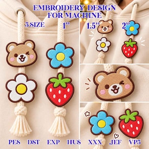 Puede incluir: Diseños de bordado a máquina con un oso marrón, una flor blanca con centro amarillo, una flor azul con centro amarillo y una fresa roja. Los diseños están disponibles en tamaños de 2,5 cm, 3,8 cm y 5 cm, compatibles con formatos PES, DST, EXP, HUS, XXX, JEF y VP3.