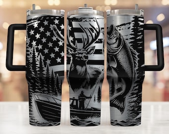 May include: A stainless steel tumbler with a black and white design featuring an American flag, a deer, a fish, and a boat. The tumbler has a black handle.