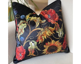 May include: Black velvet pillow with embroidered floral design featuring sunflowers, poppies, and leaves in shades of red, yellow, orange, and green.