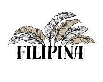 May include: A sticker with a black and white illustration of stylized feathers in shades of brown. The word "FILIPINA" is written in black below the feathers.