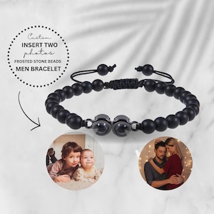 May include: Black beaded bracelet with two round photo inserts. The bracelet has a black cord with a knot closure. The text "Custom Insert Two Photos Frosted Stone Beads Men Bracelet" is visible in the image.