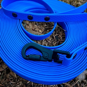 CUSTOM Training Line & Tracking Leash with Hexa Water-Resistant Webbing – This long dog leash offers a durable, waterproof solution for training and tracking. Fully adjustable for the perfect fit, it provides excellent control and flexibility for energetic dogs during outdoor activities. Ideal for off-leash training and long-distance walks, this pet gear combines rugged construction with user-friendly design to meet the demands of active pet lifestyles.