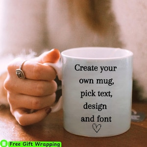 May include: A white ceramic mug with the text "Create your own mug, pick text, design and font" and a small heart symbol.
