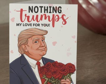 May include: A Valentine's Day card featuring a cartoon illustration of Donald Trump holding a bouquet of red roses. The card reads "Nothing trumps my love for you!"