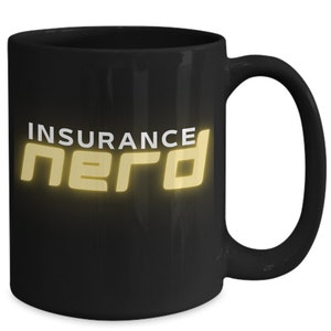 May include: Black ceramic mug with the words "INSURANCE NERD" in a gold, glowing font. The mug has a large handle and a glossy finish, perfect for coffee or tea.