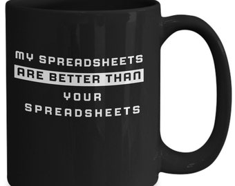 May include: Black coffee mug with white text that reads "My spreadsheets are better than your spreadsheets".