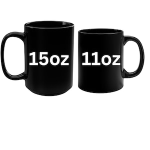 two black coffee mugs with white numbers on them