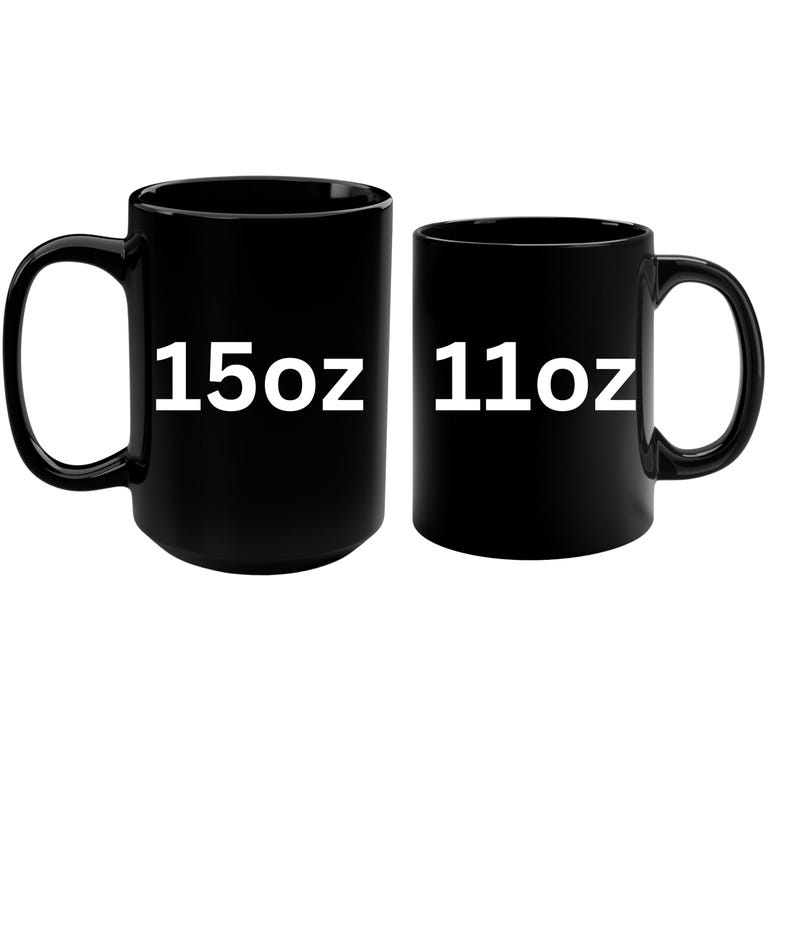two black coffee mugs with white numbers on them
