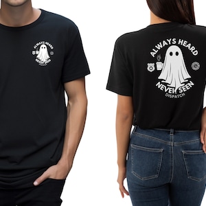 May include: Black t-shirt with a white ghost graphic and the text "Always Heard Never Seen Dispatch".