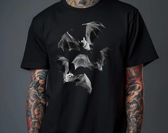 May include: Black t-shirt with a graphic print of five white bats in flight.