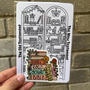 May include: A sticker with a stack of books and flowers, with the text "GIRL READ YOUR BIBLE" in colorful letters.