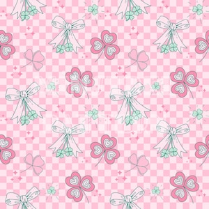 May include: A repeating pattern on a light pink and white checkered background featuring light green four-leaf clovers tied with white bows, pink heart-shaped clover leaves with white outlines, and small four-pointed star accents throughout.