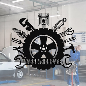 May include: Black and white logo for Yassin's Garage, featuring a tyre with a wrench, a piston, a spark plug, and other tools around it.