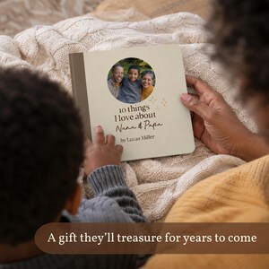 Adult and child viewed from behind reading a personalized grandparents board book together on a sofa. Text reads “A gift they’ll treasure for years to come.”