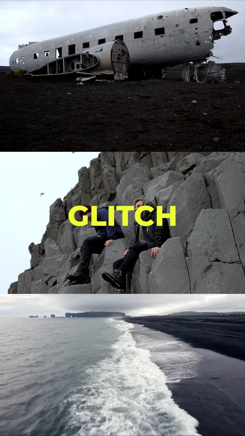 May include: A black and white photo of a plane wreck on a black sand beach. The plane is partially buried in the sand and is missing its wings. The plane is surrounded by black sand and rocks. The sky is cloudy and gray.