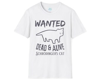 May include: White t-shirt with the text "WANTED DEAD & ALIVE SCHRÖDINGER'S CAT" in dark gray. A black outline of a cat is featured above the words "DEAD & ALIVE". The shirt has short sleeves and a crew neck.
