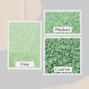 May include: An image displays three samples of green glass, labeled "Fine", "Medium", and "Coarse". The samples are in white-bordered rectangles, showcasing the varying sizes of the glass pieces. The background is a neutral gray and beige.