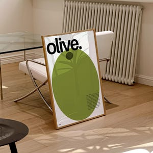 May include: A framed poster featuring a green olive illustration and the word "olive." in black text. The poster has a white background and a wooden frame.