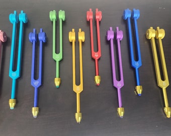9 Secret Solfeggio Weighted Tuning Forks Set with Individually Marked Bags and Striker with Removable Gem Feet