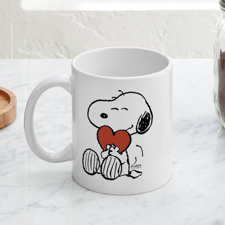 CafePress Snoopy Hugs Heart Taza de café de cerámica, taza de té