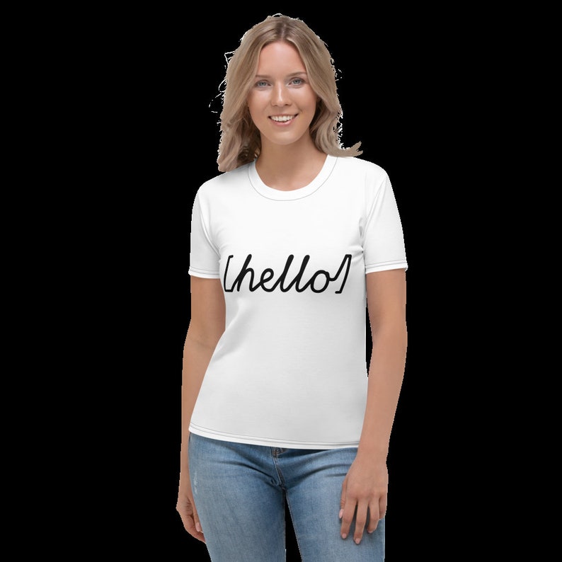 May include: White women's t-shirt with short sleeves and a crew neck. The shirt has the word "hello" written in black cursive script.