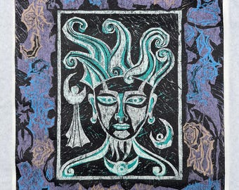 May include: A black and white print featuring a stylized face with teal accents and a crown of swirling shapes. The print is framed by a border of purple, blue, and tan floral and abstract designs. The artwork is on a white background.